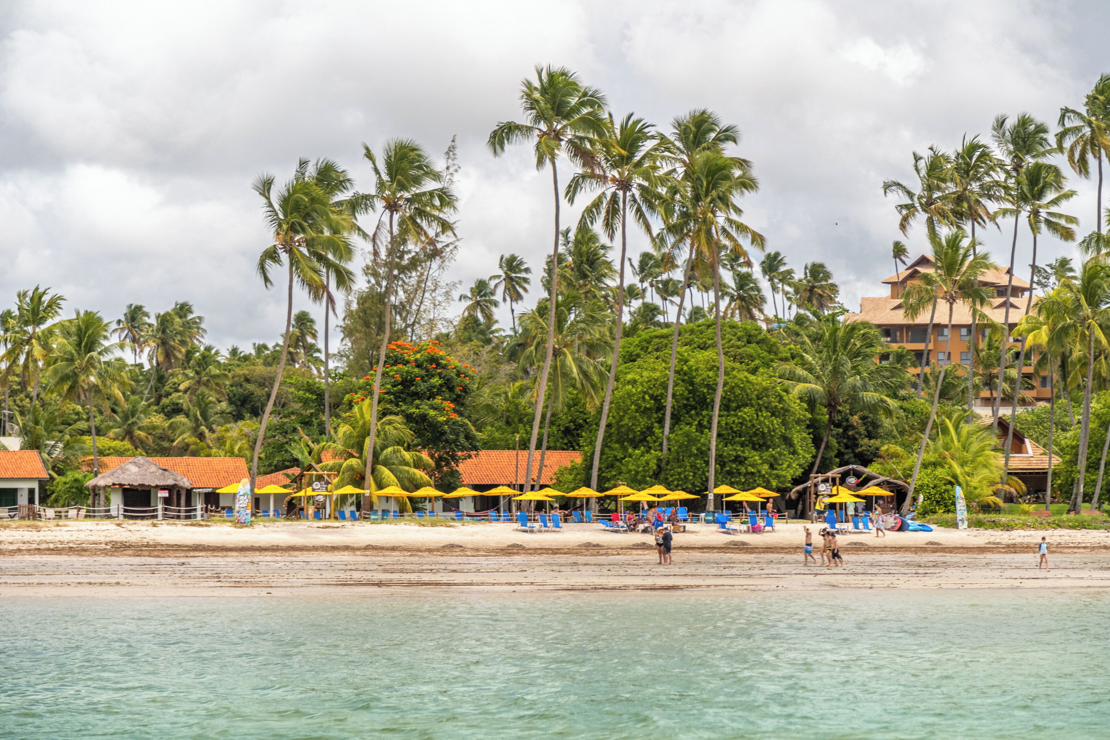 On the beach, white sand, sun loungers, beach umbrellas