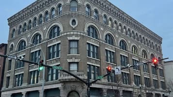 A historic building with arched windows and a corner location at Fulton Street intersection.