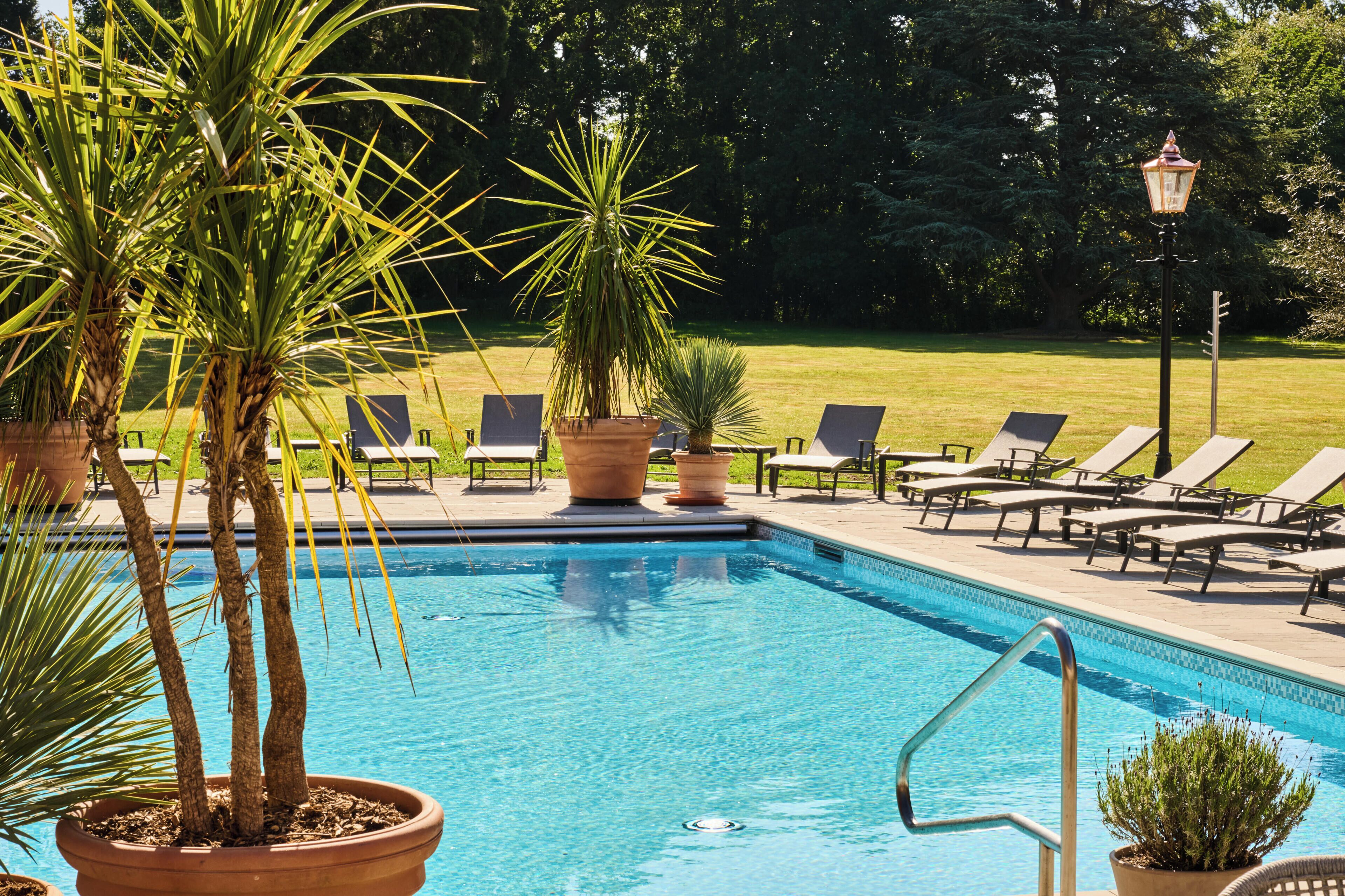 Outdoor pool, open 7:00 AM to 10:00 PM, pool umbrellas, pool loungers