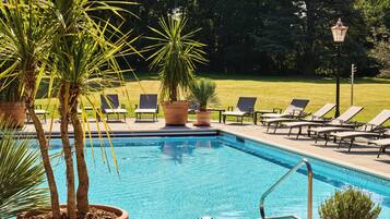 Outdoor pool, open 7:00 AM to 10:00 PM, pool umbrellas, pool loungers