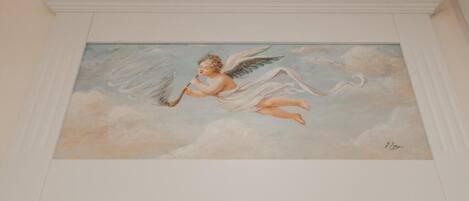 A painting of an angel in a cloud.