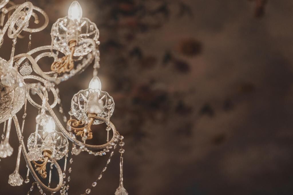 A chandelier with multiple crystal elements and lights.