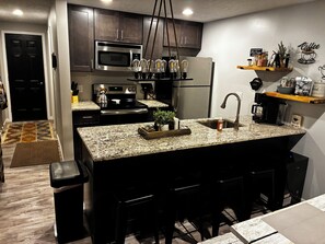 Coffee/tea maker, fridge, microwave, oven