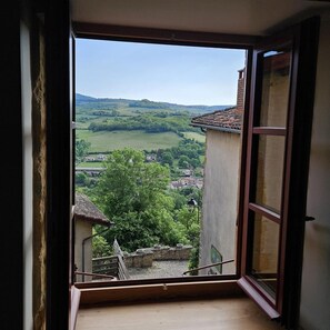 A room with a large window overlooking a village and green hills. - Alice's House - TERNAND (TERNAND)