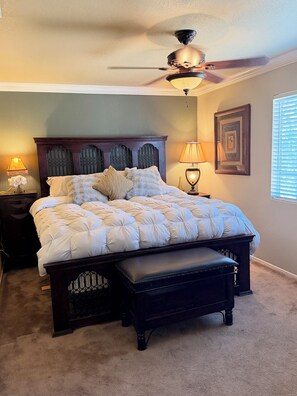 A bedroom with a bed, a bench, a ceiling fan, two bedside lamps, and a framed picture on the wall. - Beautiful family and pet friendly estate in Temecula Wine Country region (Aguanga)