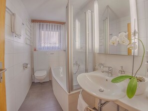 A bathroom with a toilet, shower, and sink. - Bergrose Appartement/Fewo 5-Bettwohnung Nr. 2 by Interhome (Saas-Fee)