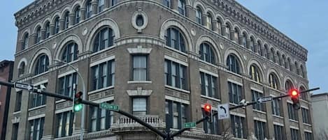 A historic building with arched windows and a corner location at Fulton Street intersection.