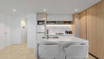 Coffee/tea maker, fridge, microwave, oven