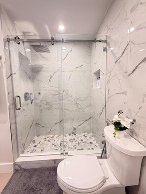 Shower, towels, soap, toilet paper