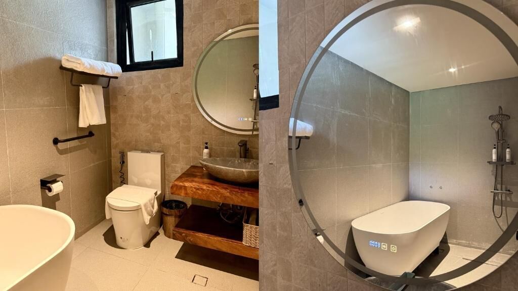 A bathroom with a toilet, sink, and bathtub.
