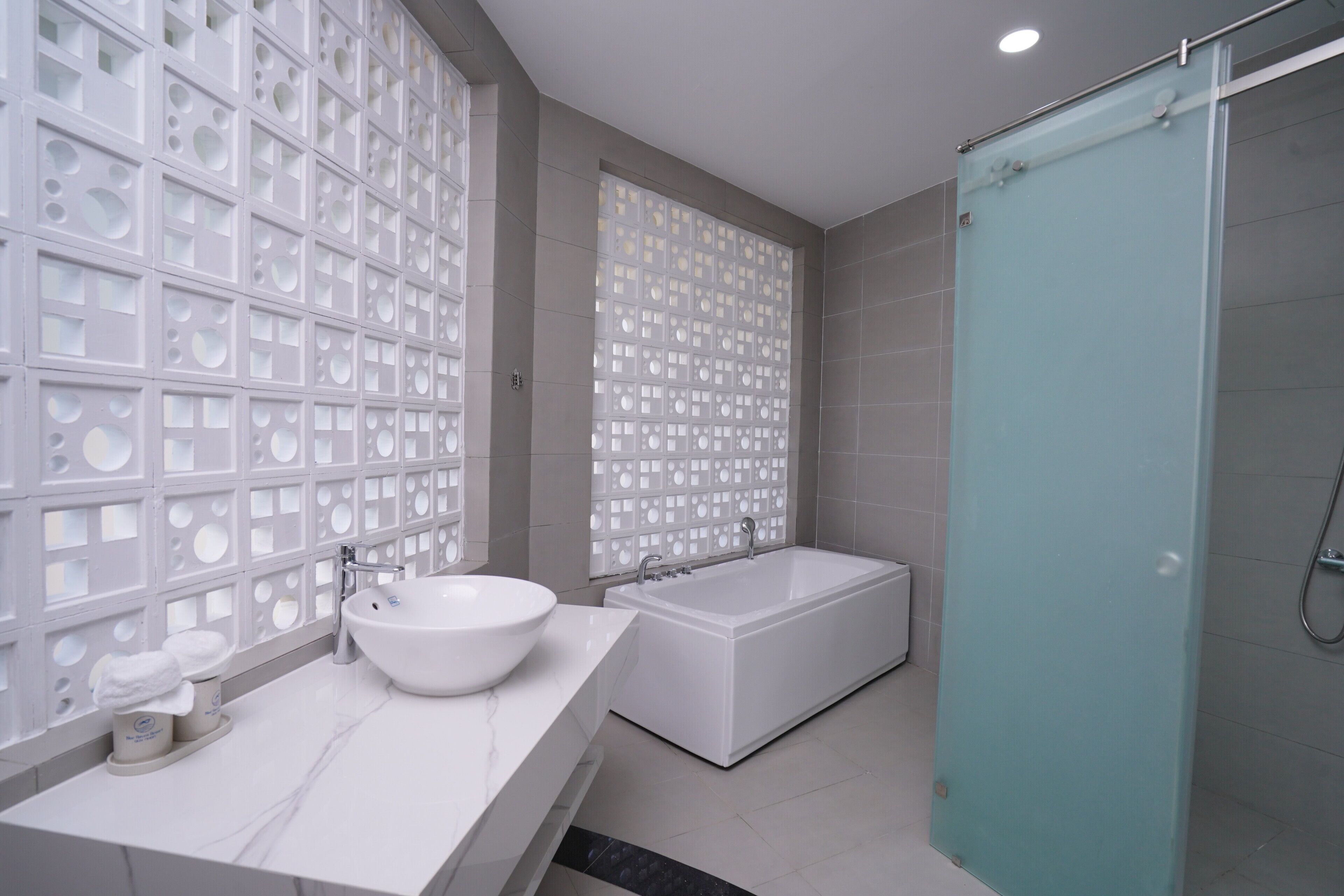 Luxury Bungalow, 1 Queen Bed, Ocean View | Bathroom | Hair dryer, slippers, towels, soap