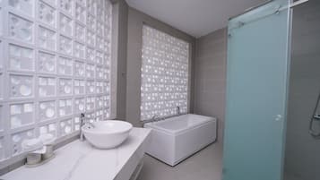 Luxury Bungalow, 1 Queen Bed, Ocean View | Bathroom | Hair dryer, slippers, towels, soap