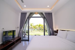 Bungalow Deluxe, 1 giường cỡ queen, quang cảnh biển | Két bảo mật tại phòng, khu vực làm việc phù hợp cho laptop