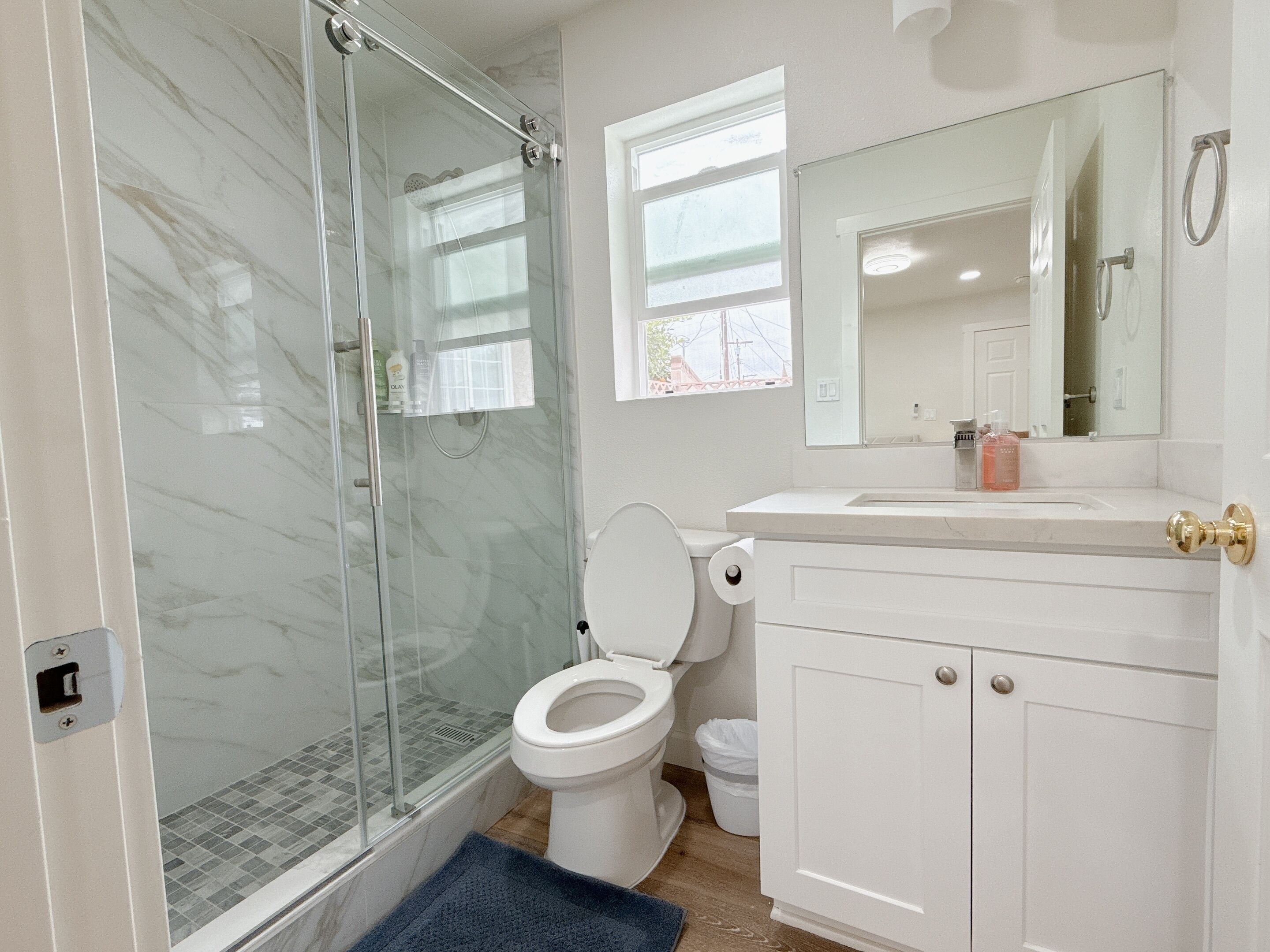 Shower, hair dryer, towels, soap