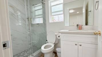 Shower, hair dryer, towels, soap