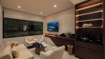 Family Suite | Living area | 48-inch flat-screen TV with digital channels