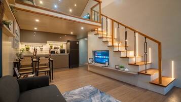 Deluxe Villa, Garden View | Living area | 36-inch Smart TV with cable channels
