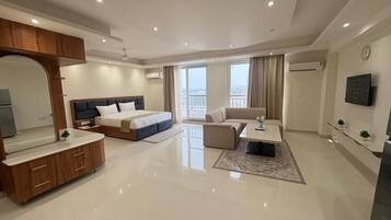 Executive Suite, Balcony, City View | Desk, laptop workspace, free WiFi