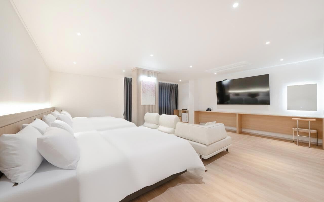 Family Room | Premium bedding, desk, laptop workspace, blackout drapes