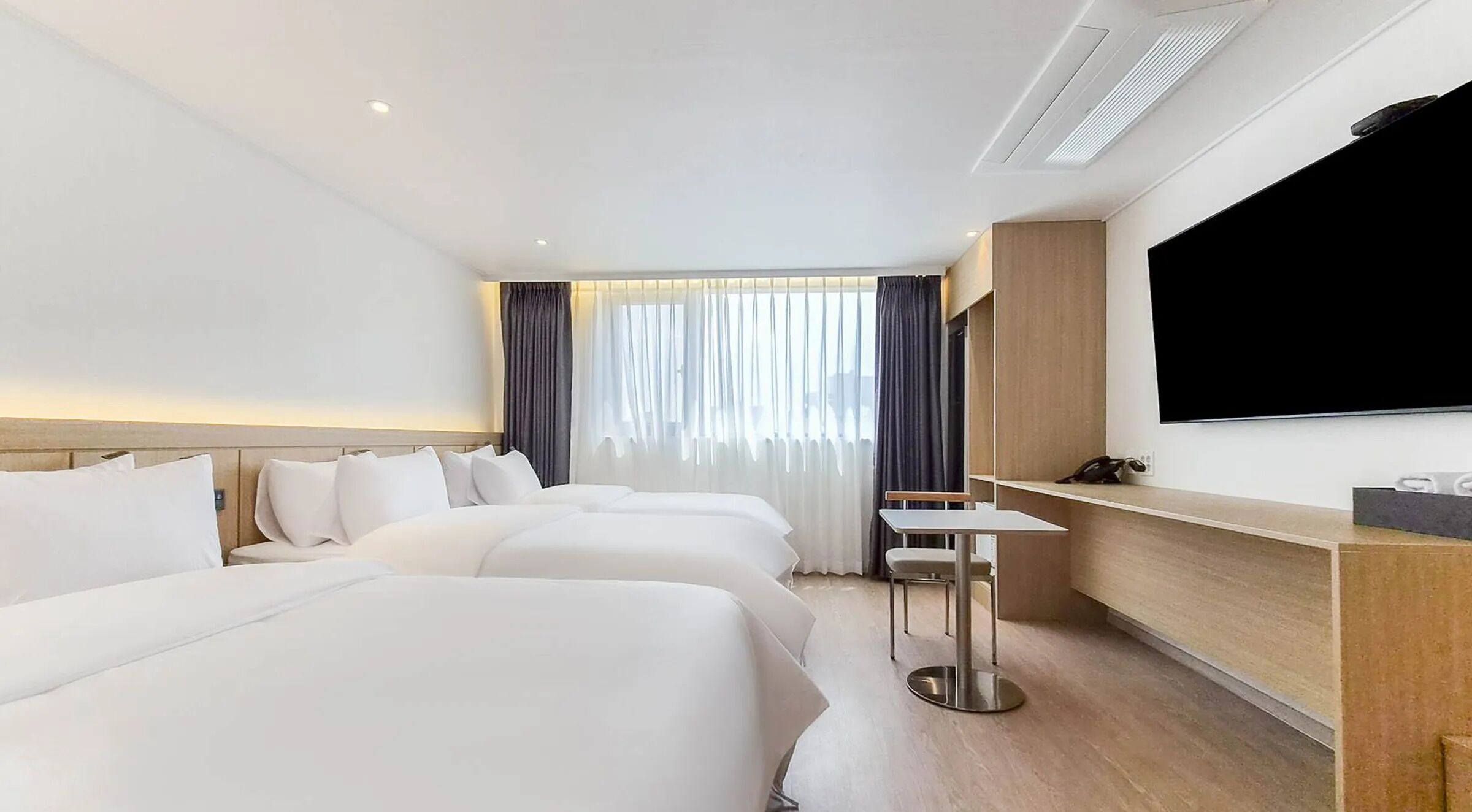 Signature Triple Room | Premium bedding, desk, laptop workspace, blackout drapes