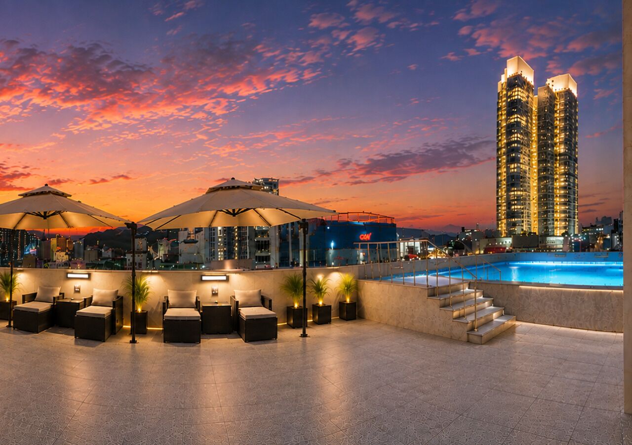 Seasonal outdoor pool, open 5:00 PM to 8:00 PM, pool umbrellas