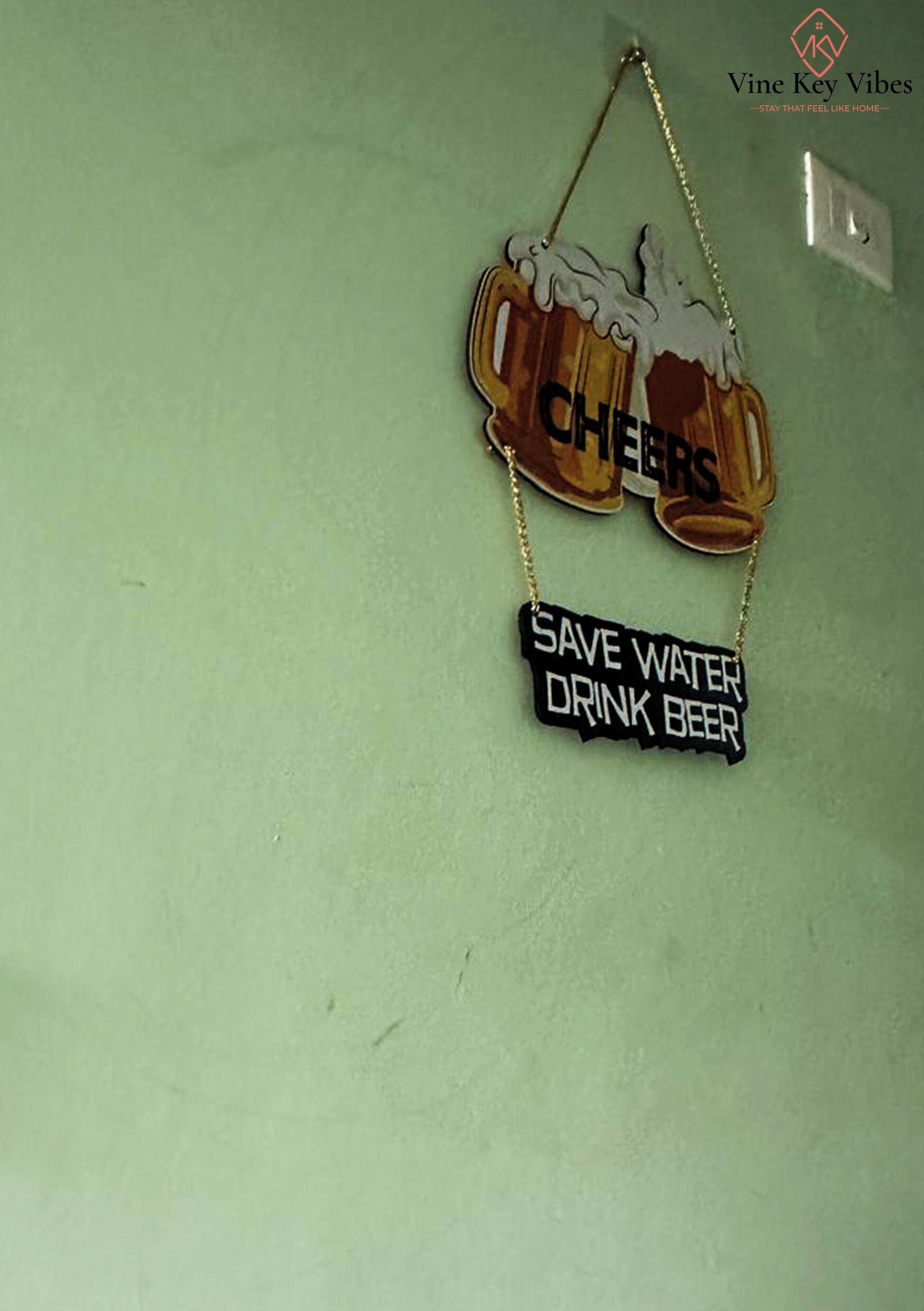 A wall-mounted sign with two beer mugs and a message encouraging to 'SAVE WATER DRINK BEER.'