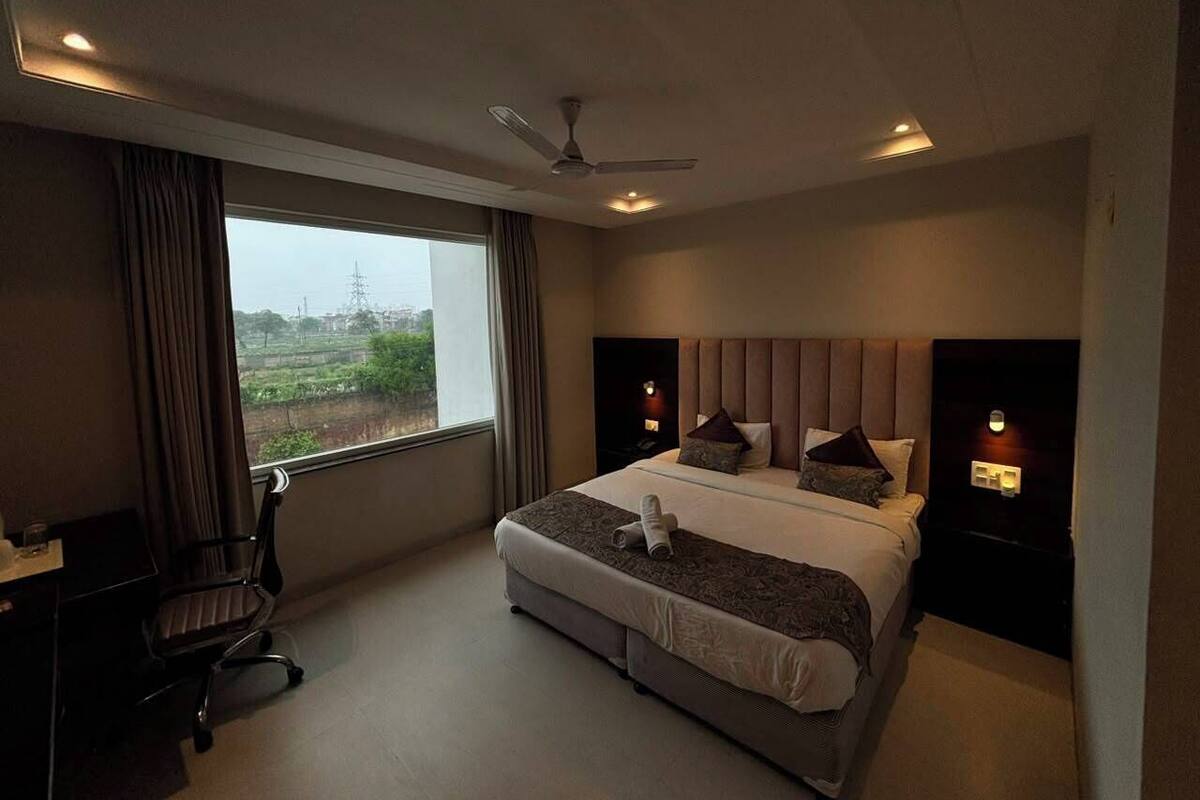 Premium Double Room, Balcony, Garden View( Unmarried couples not allowed) | In-room safe, desk, laptop workspace, blackout drapes