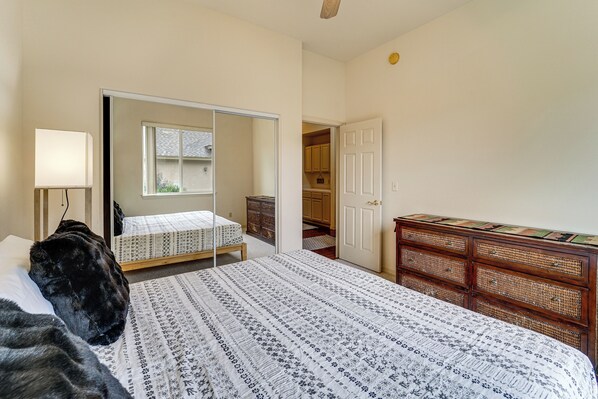 A bedroom with a bed, a mirror, a dresser, and a closet. - Soak, Hike & Golf: Durango Escape w/ Hot Tub! (Durango)