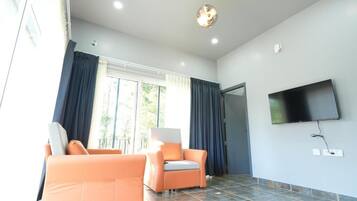 Suite, balcon | Coin séjour