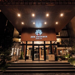 A building entrance with a sign reading 'ZEN ESSENCE' and 'KHAO YAI'. - Zen Essence Khao Yai (Pak Chong)
