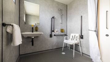 Shower, hair dryer, towels, shampoo