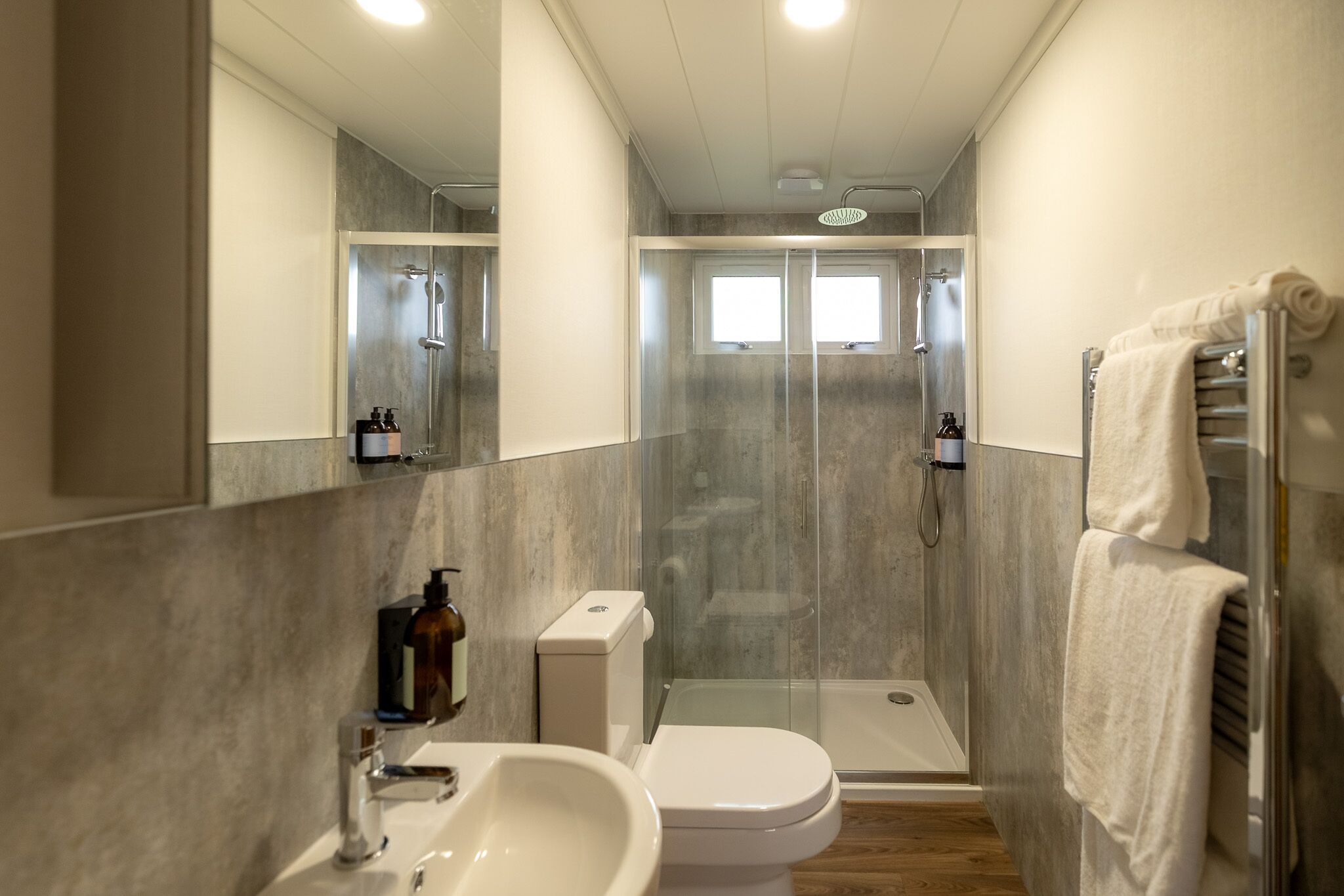Shower, hair dryer, towels, shampoo