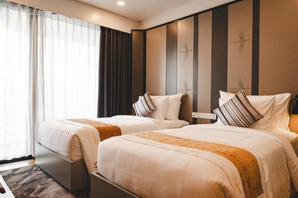 Camera Deluxe con letto matrimoniale o 2 letti singoli, patio, vista cortile | Una cassaforte in camera, insonorizzazione, Wi-Fi gratuito