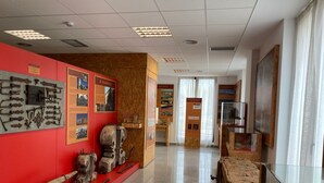 A museum interior with historical exhibits, informational plaques, and a polished floor. - EL MENSARIO (Campisábalos)