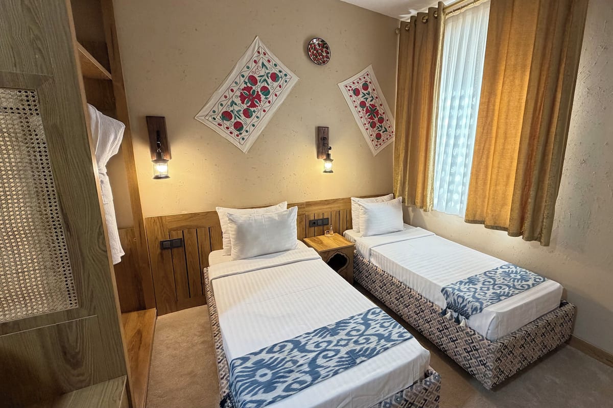 Habitación estándar con 2 camas individuales | Ropa de cama