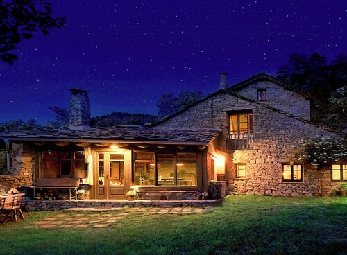 Isolated stone and timber house in the forest
