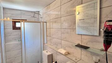 Suite, Garden View | Bathroom | Shower, hair dryer, towels, soap