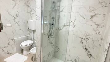 Shower, free toiletries, hair dryer, towels
