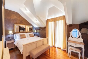 A bedroom with a bed, bench, nightstand, dresser, mirror, and curtains. - Charming 4-Bedroom Stone Villa with Pool & Garden, 15 Min to Dubrovnik (Knežica)