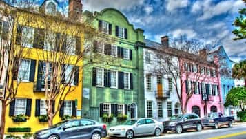 A row of colorful buildings with a street in front.