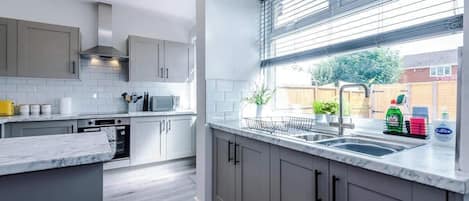 Coffee/tea maker, fridge, microwave, oven