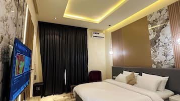 Deluxe Room, Balcony, City View | Desk, laptop workspace, blackout curtains, soundproofing
