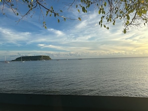 A calm sea with boats and a distant island. - 3-bedroom cottage in Vieques w Wifi,  AC, breeze, free parking and pets friendly (Vieques)