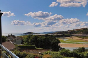 A coastal landscape with a view of the sea, a beach, and a hill in the distance. - Petrichor - coastal retreat in Bantham South Devon (Bantham)