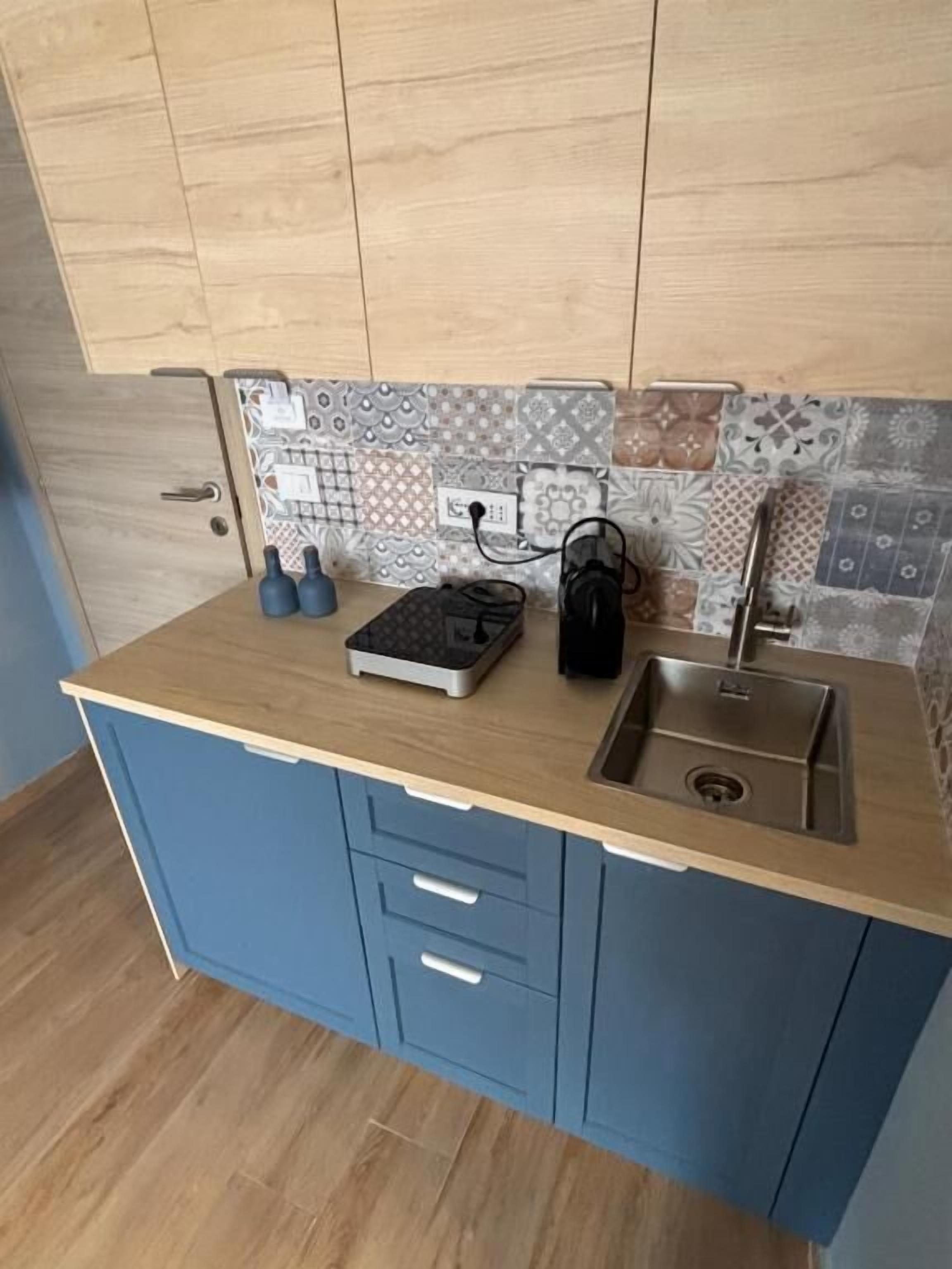 Estudio Deluxe, vistas a la ciudad | Cocina privada