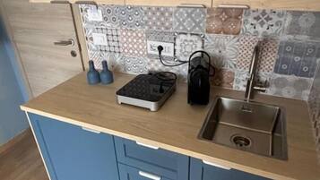 Estudio Deluxe, vistas a la ciudad | Cocina privada