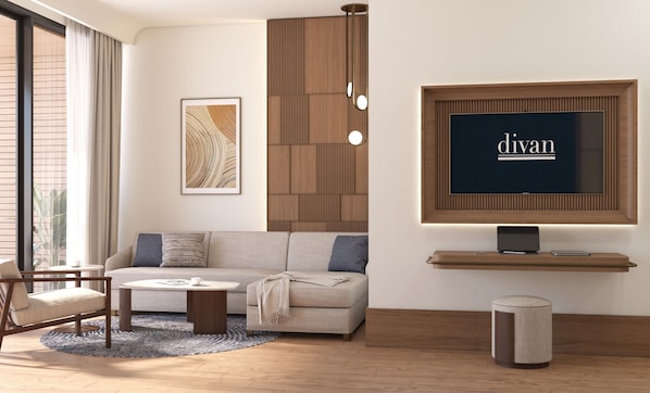 Habitación doble Deluxe, balcón, vista al mar | Área de sala de estar