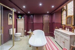 A bathroom with a freestanding bathtub, a vanity with a mirror, a toilet, and a shower area. - Grade C Church in Cannich, Sleeps 2 w/ Parking (Beauly)
