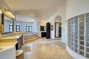 A spacious bathroom with a large vanity, a bathtub, and a glass-enclosed shower area. - Hillside Costa Azul Villa with Pool, Hot Tub & Ocean Views (San Jose del Cabo)
