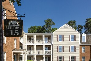 A multi-story building with a sign indicating 'Building 15'. - BLOCK WM Kingsgate 2br (Williamsburg)